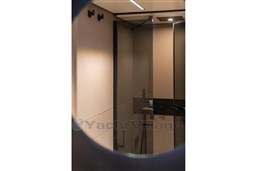 Interior of 2025 VanDutch 75 yacht, featuring sleek, modern bathroom design.