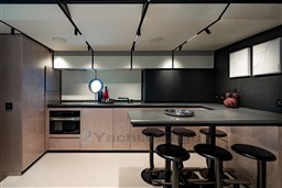 Modern kitchen interior on 2025 VanDutch 75 yacht, featuring sleek design and contemporary furnishings.