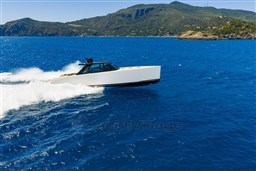 VanDutch 75 yacht cruising in blue ocean near scenic coastline, 2025 model.