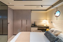 Luxurious VanDutch 75 yacht interior bedroom with modern decor and ambient lighting, 2025 model.