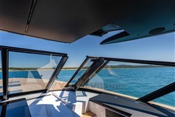 Luxurious VanDutch 75 yacht interior with panoramic ocean view, 2025 model.