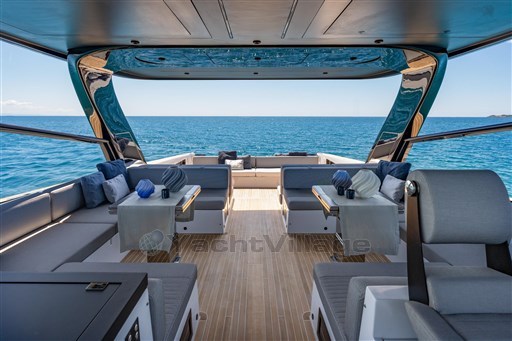 Luxurious 2025 VanDutch 75 yacht interior with ocean view, featuring elegant seating and modern design.