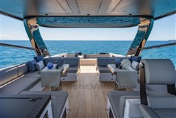 Luxurious 2025 VanDutch 75 yacht interior with ocean view, featuring elegant seating and modern design.