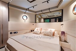 Luxurious bedroom interior of 2025 VanDutch 75 yacht with modern design and elegant decor.