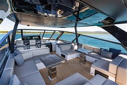 Luxurious interior of 2025 VanDutch 75 yacht with modern seating and ocean view.