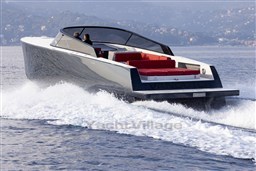 VanDutch 48 yacht cruising on water, 2025 model, sleek design with red seating.