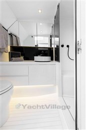 Luxurious bathroom in 2025 VanDutch 48 yacht with modern fixtures and sleek design.
