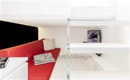 Interior of 2025 VanDutch 48 yacht with red seating and modern design.