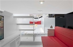 Luxurious interior of 2025 VanDutch 48 yacht with modern design and red seating.