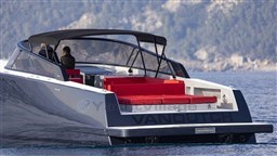 VanDutch 48 yacht, 2025 model, with sleek design and red seating, cruising on open water.