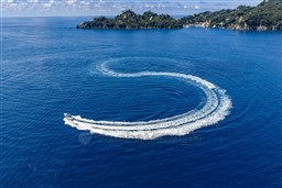 Aerial view of 2026 Pardo Yachts 43 creating circular wake in blue ocean.