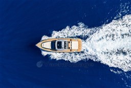 Aerial view of 2026 Pardo Yachts 43 cruising on deep blue ocean waters.