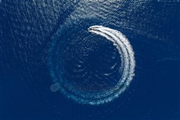 Aerial view of 2026 Pardo Yachts 43 making a circular wake in deep blue ocean.