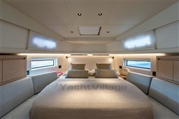 Luxurious interior cabin of 2026 Pardo Yachts 43, featuring elegant bedding and modern design.