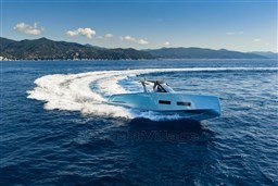 2026 Pardo Yachts 43 cruising on open sea with scenic mountain backdrop.