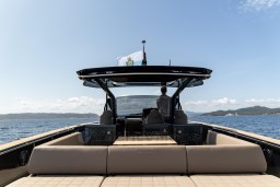 2025 Pardo Yachts 50 cruising on open water with scenic coastal backdrop.