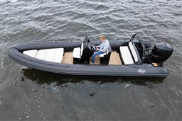 2021 Infanta 750 boat on water, featuring sleek design and comfortable seating.