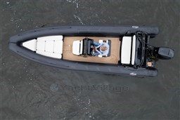 Overhead view of 2021 Infanta 750 boat on water, featuring sleek design and comfortable seating.
