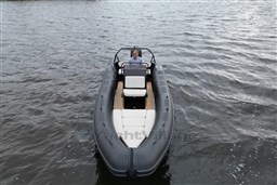 2021 Infanta 750 boat on water, featuring sleek design and comfortable seating.