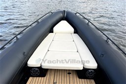 Infanta 750 boat, 2021 model, featuring a sleek black exterior and white cushioned seating.