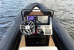 Inflatable boat Infanta 750, 2021 model, with steering console on water.