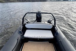 2021 Infanta 750 boat on water, featuring sleek design and comfortable seating.