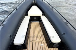 Infanta 750 boat interior, 2021 model, featuring cushioned seating and wooden deck.