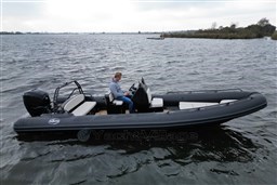 2021 Infanta 750 boat on water with driver, showcasing sleek design and performance.