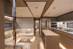 Luxurious interior of 2025 Pardo Yachts GT75, featuring modern kitchen and cozy seating area.