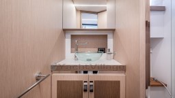 2024 Apreamare GOZZO 38 CABIN bathroom with modern sink and wooden cabinetry.