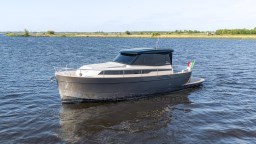 2024 Apreamare GOZZO 38 CABIN yacht on calm water, showcasing sleek design and modern features.