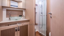 Luxurious bathroom in 2024 Apreamare GOZZO 38 CABIN yacht with modern fixtures and glass shower.