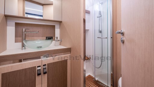Luxurious bathroom in 2024 Apreamare GOZZO 38 CABIN yacht with modern fixtures and glass shower.