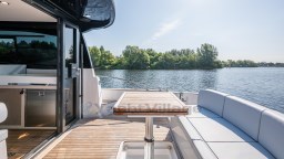 2024 Apreamare GOZZO 38 CABIN yacht with elegant deck, lake view, and modern seating.