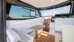 2024 Apreamare GOZZO 38 CABIN interior with white seating and wooden flooring.