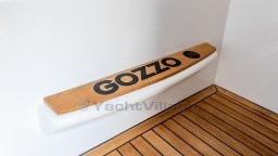 2024 Apreamare Gozzo 38 Cabin interior detail with wooden flooring and branded step.