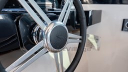 Steering wheel of 2024 Apreamare GOZZO 38 CABIN yacht, featuring sleek metallic design.