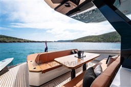 Luxury deck of 2024 Wider Wilder 60 yacht with scenic ocean view.