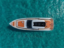 Aerial view of 2024 Wider Wilder 60 yacht on turquoise water.