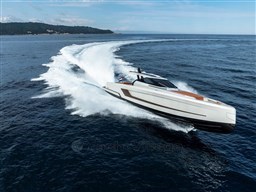 2024 Wider Wilder 60 yacht cruising swiftly on open sea, leaving a dynamic wake.
