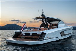 2024 Wider Wilder 60 yacht at sunset on calm waters.