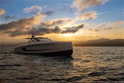 2024 Wider Wilder 60 yacht at sunset on the ocean.