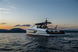 2024 Wider Wilder 60 yacht at sunset on calm waters.