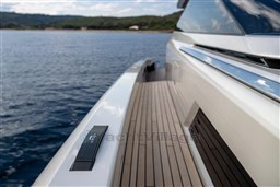 2024 Wider Wilder 60 yacht deck with sleek design on calm waters.