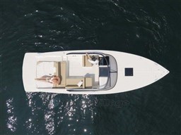 Aerial view of 2025 VanDutch 32 yacht cruising on open water.
