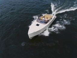 2025 VanDutch 32 yacht cruising on open water, featuring sleek design and luxury seating.