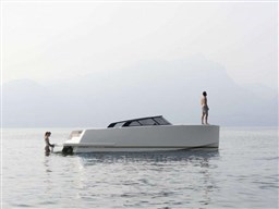 2025 VanDutch 32 yacht on calm water with two people enjoying the view.