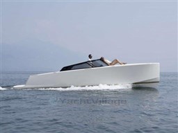 2025 VanDutch 32 yacht cruising on open water, sleek modern design, two passengers relaxing.