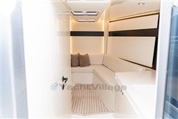 Luxurious interior of 2024 VanDutch 40 yacht with sleek white seating and modern design.