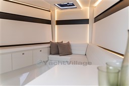 Luxurious interior of 2024 VanDutch 40 yacht with modern seating and ambient lighting.